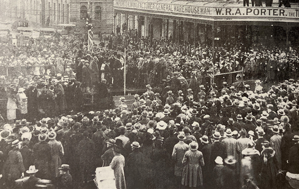 Lady Rous preparing to cut the ribbon in front of a large crowd on Amalgamation Day